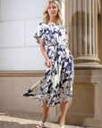 Jurk in fancy leaves met zakken